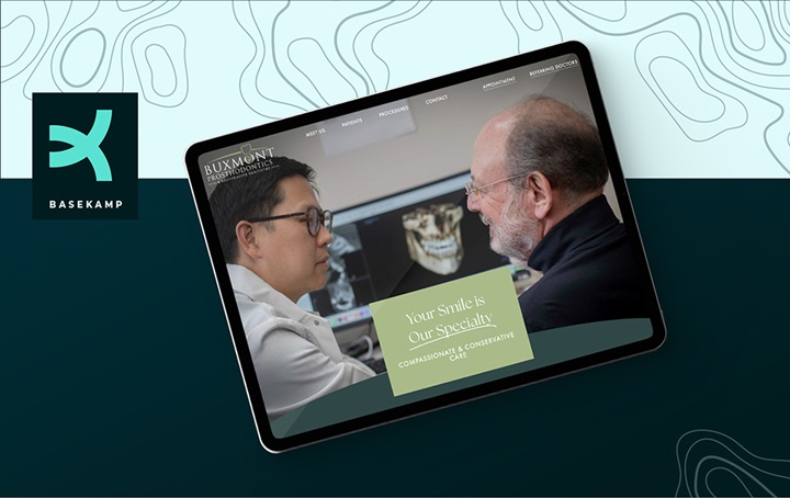 BaseKamp, two people on a tablet